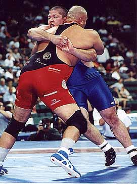 Ghaffari (red) holds onto Billy Pierce at the 2000 Olympic Trials. 